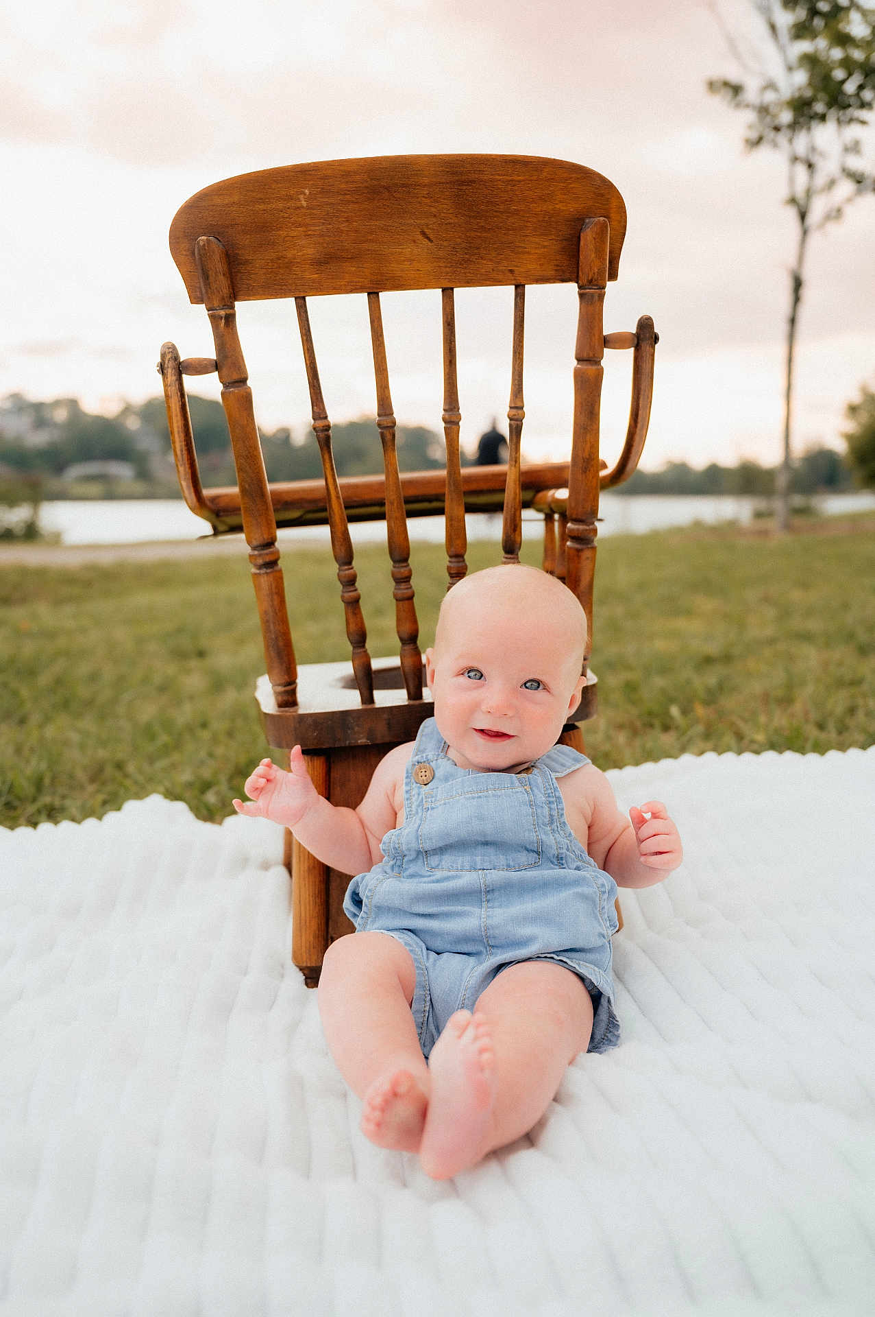Maddox joined the competition — help win amazing prizes! baby, denim_overalls, wooden_chair, blanket, outdoor, grass, smiling, blue_eyes, infant, nature, relaxing, daylight, cute, child, portrait, summer, peaceful, playing, sitting, happy