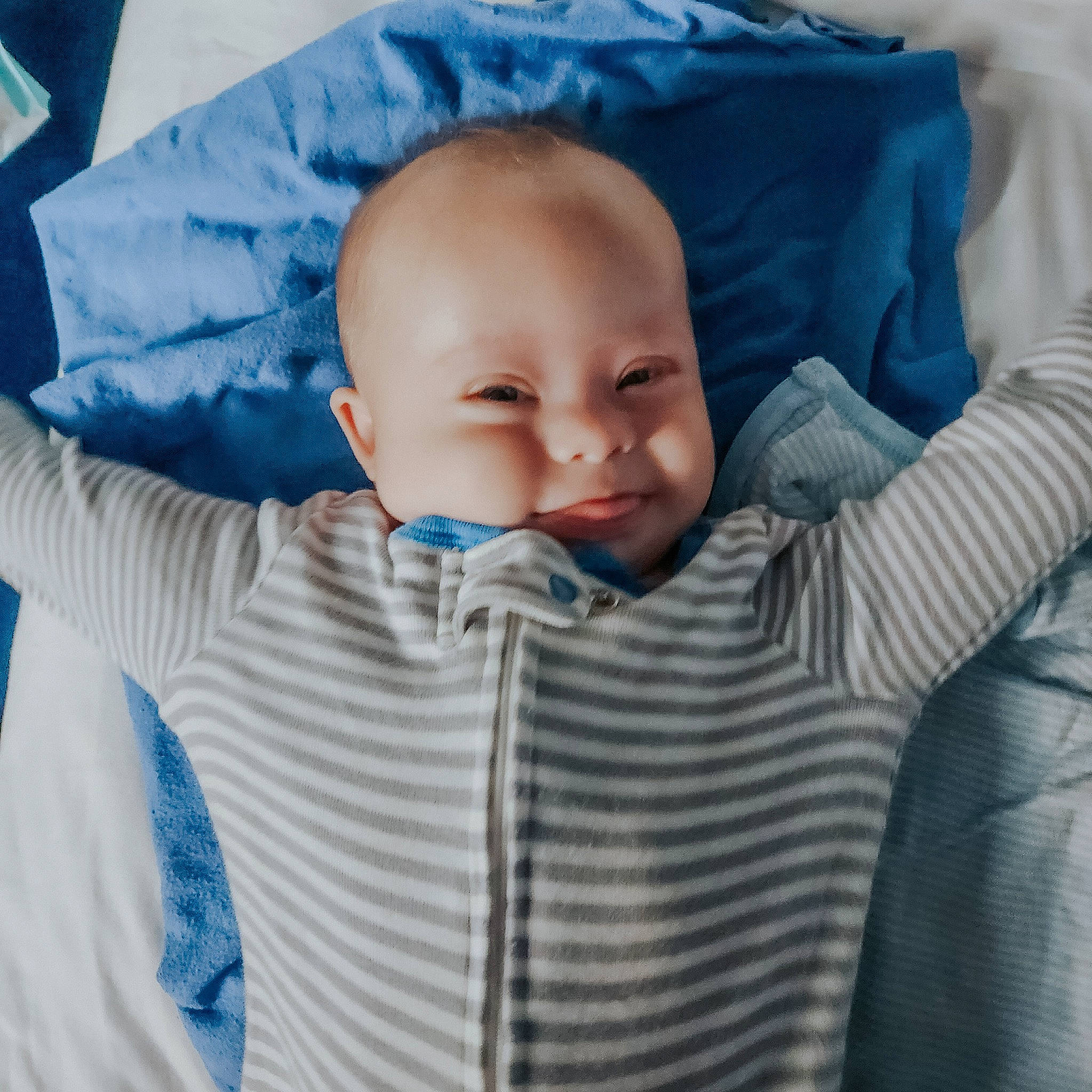 Caleb is registered to the contest to win money with this photo: baby, baby_products, baby_sleeping, baby_toddler_clothing, cheek, child, collar, comfort, electric_blue, eye, eyebrow, facial_expression, gesture, linens, mouth, nose, person, skin, sleeve, textile
