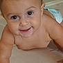 baby, crawling, diaper, play_mat, smile, drool, face, child, infant, skin, arm, hand, eyes, cheeks, indoors, floor, cute, young, person, portrait