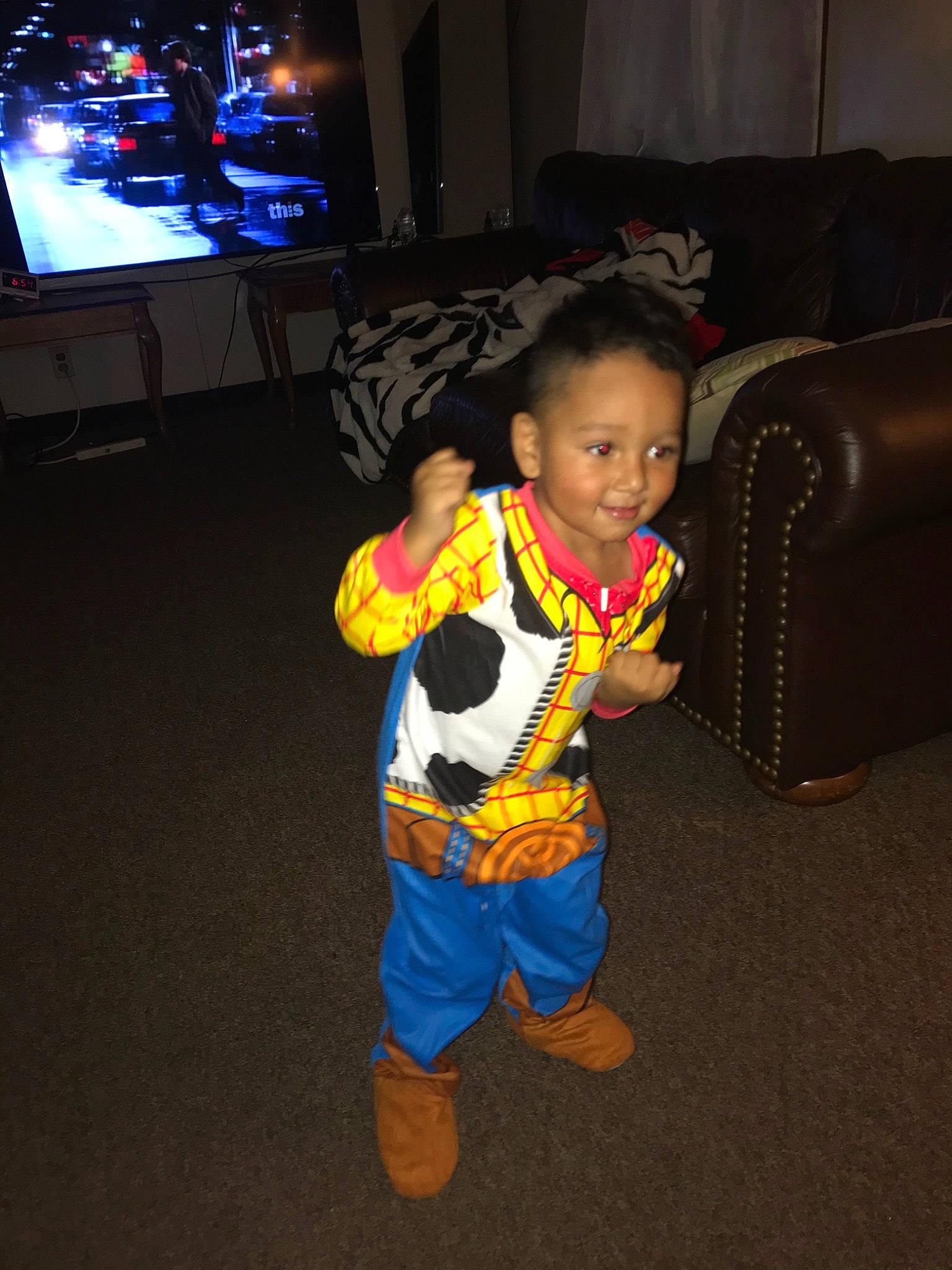 Alfonso is registered to the contest to win money with this photo: child, electronic_device, fun, person, play, smile, standing, technology, toddler, vacation