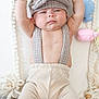 Aiden joined the competition — help win amazing prizes! baby, infant, child, hat, cap, suspenders, pants, wooden_block, plush_toy, knitted, arm_raised, face, cheeks, cute, indoors, portrait, neutral_expression, clothing, soft_toys, seated