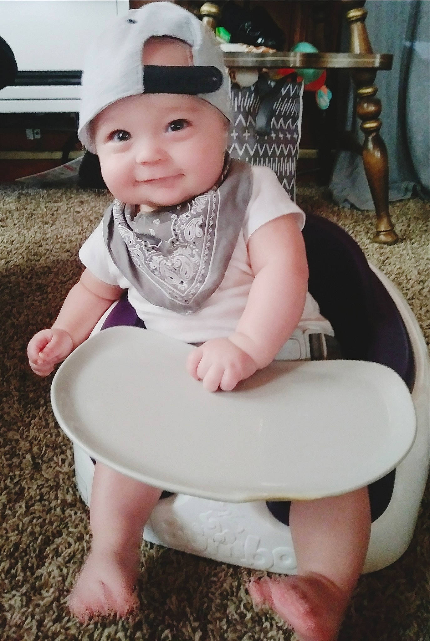 Arrow is registered to the contest to win money with this photo: baby, baby_toddler_clothing, chair, child, fashion_accessory, fun, furniture, hat, headgear, headwear, leg, person, play, sitting, skin, smile, sun_hat, toddler