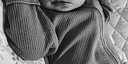 Ivy is registered to the contest to win money with this photo: baby, sleeping, onesie, ribbed_clothing, blanket, floral_pattern, quilted, black_and_white, infant, peaceful, resting, portrait, close_up, face, head, arms, cozy, soft_lighting, indoor, cute