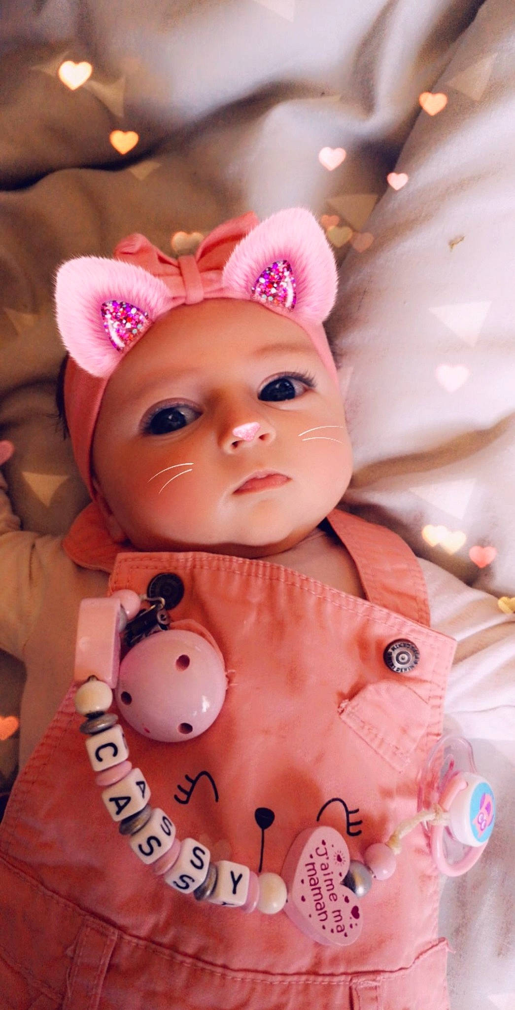 Cassy participe au concours pour gagner de l'argent avec cette photo : baby, cheek, child, doll, ear, head, person, pink, toy