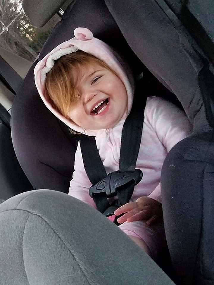 Kaelyn is registered to the contest to win money with this photo: auto_part, baby_in_car_seat, car, car_seat, car_seat_cover, child, facial_expression, family_car, fun, joy, person, seat_belt, smile, steering_wheel, toddler