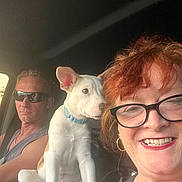 Kash is registered to the contest to win money with this photo: car, casual, collar, dog, earrings, glasses, happy, indoor, light, man, people, pet, portrait, puppy, red_hair, seatbelt, smiling, sunglasses, vehicle_interior, woman