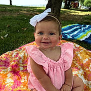 Ella joined the competition — help win amazing prizes! baby, child, smiling, pink_clothing, headband, bow, blanket, outdoor, grass, tree, sunlight, park, happy, cute, sitting, portrait, infant, nature, daylight, young