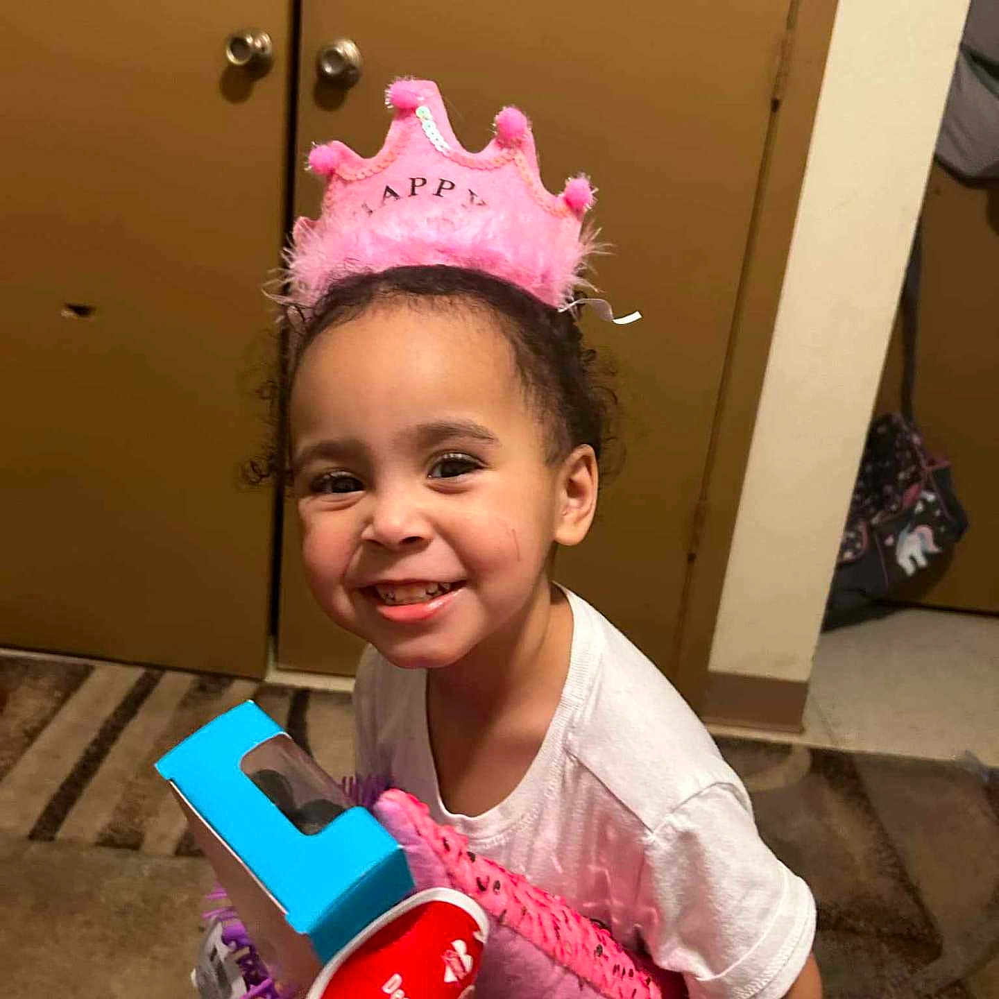 A'Myrah is registered to the contest to win money with this photo: accessories, child, clothing, costume, crown, door, dynamite, face, female, girl, glove, head, indoors, jewelry, person, photography, portrait, t_shirt, tiara, weapon