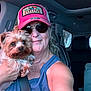 Maisy is registered to the contest to win money with this photo: car, casual, closeup, companion, dog, friendly, furry, happy, hat, interior, jewelry, pet, portrait, seatbelt, selfie, smile, sunglasses, tank_top, transportation, woman