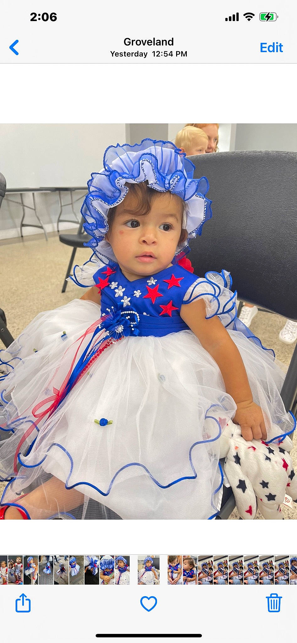 Brenda is registered to the contest to win money with this photo: baby, baby_toddler_clothing, chair, child, costume_hat, dress, electric_blue, event, fun, fur, happy, hat, headwear, pattern, person, pink, purple, sitting, textile, toddler