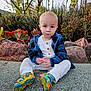 Joel is registered to the contest to win money with this photo: toddler, child, outdoor, plants, rocks, succulents, concrete, blue_jacket, white_pants, colorful_shoes, serious_expression, nature, greenery, sitting, casual_clothing, daylight, portrait, cute, baby, young_child