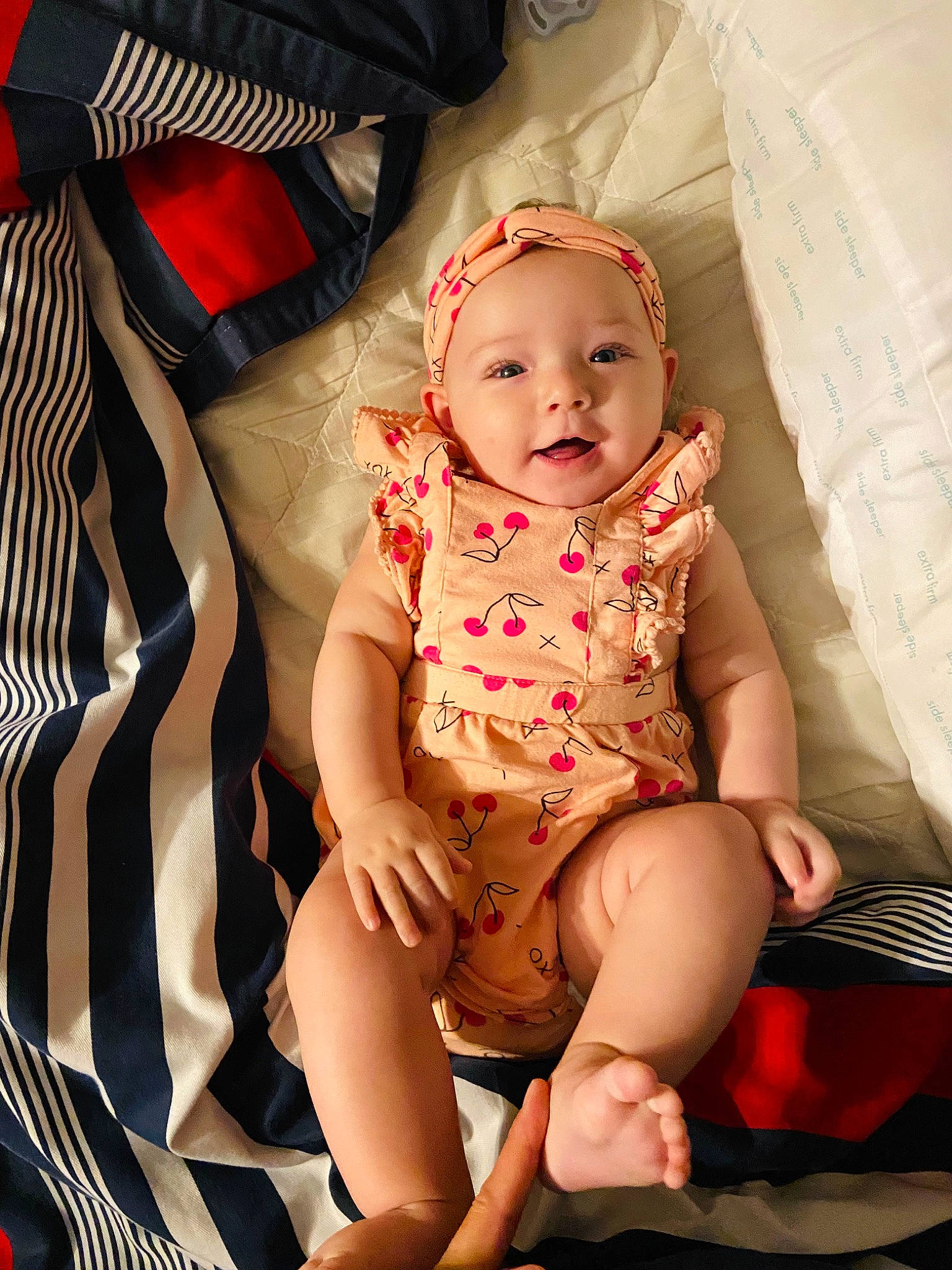 Harper is registered to the contest to win money with this photo: baby, baby_toddler_clothing, chair, cheek, child, comfort, foot, happy, headwear, human, human_leg, knee, lap, mouth, pattern, person, shorts, sitting, skin, thigh