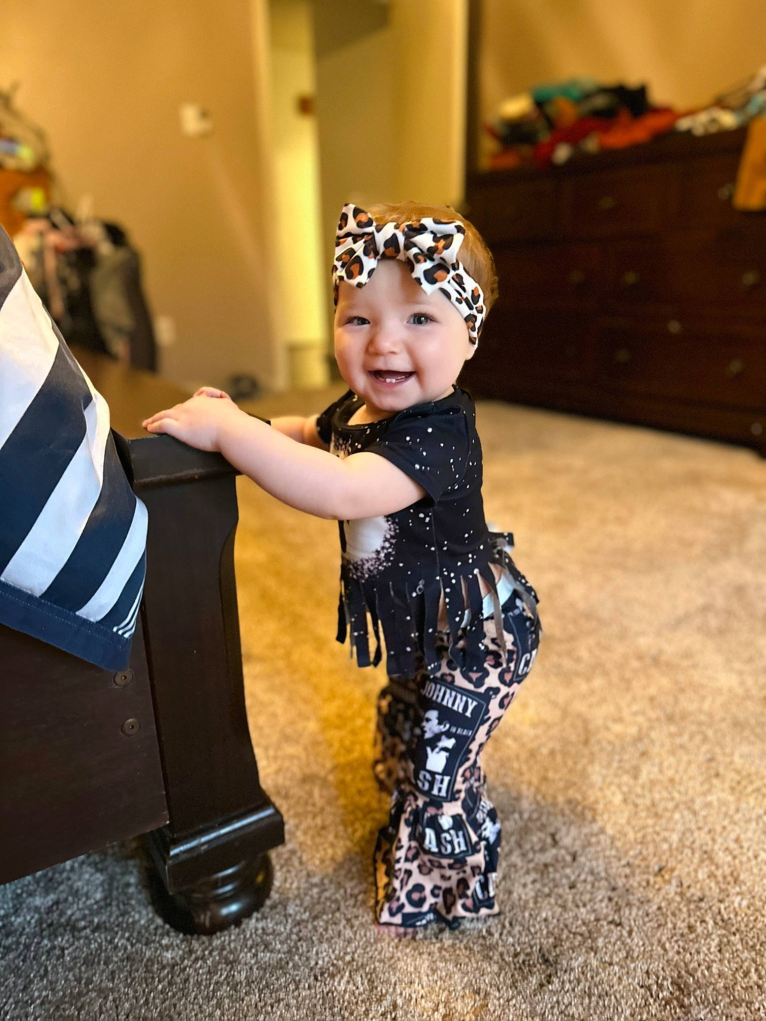 Harper is registered to the contest to win money with this photo: baby, boot, child, costume, entertainment, event, fashion_accessory, fashion_design, flag, flash_photography, flooring, formal_wear, fun, gesture, happy, headpiece, headwear, performing_arts, person, smile
