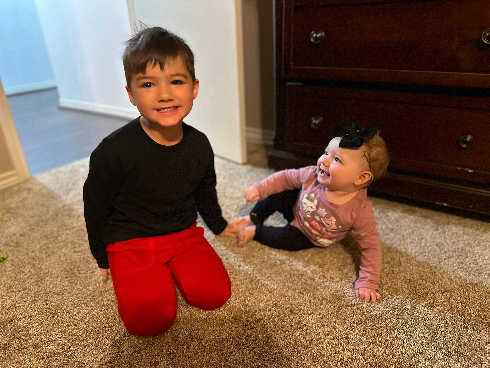 Harper joined the competition — help win amazing prizes! baby_toddler_clothing, cabinetry, child, drawer, floor, flooring, fun, gesture, happy, hardwood, head, joy, leg, people, person, skin, sleeve, smile, standing, t_shirt