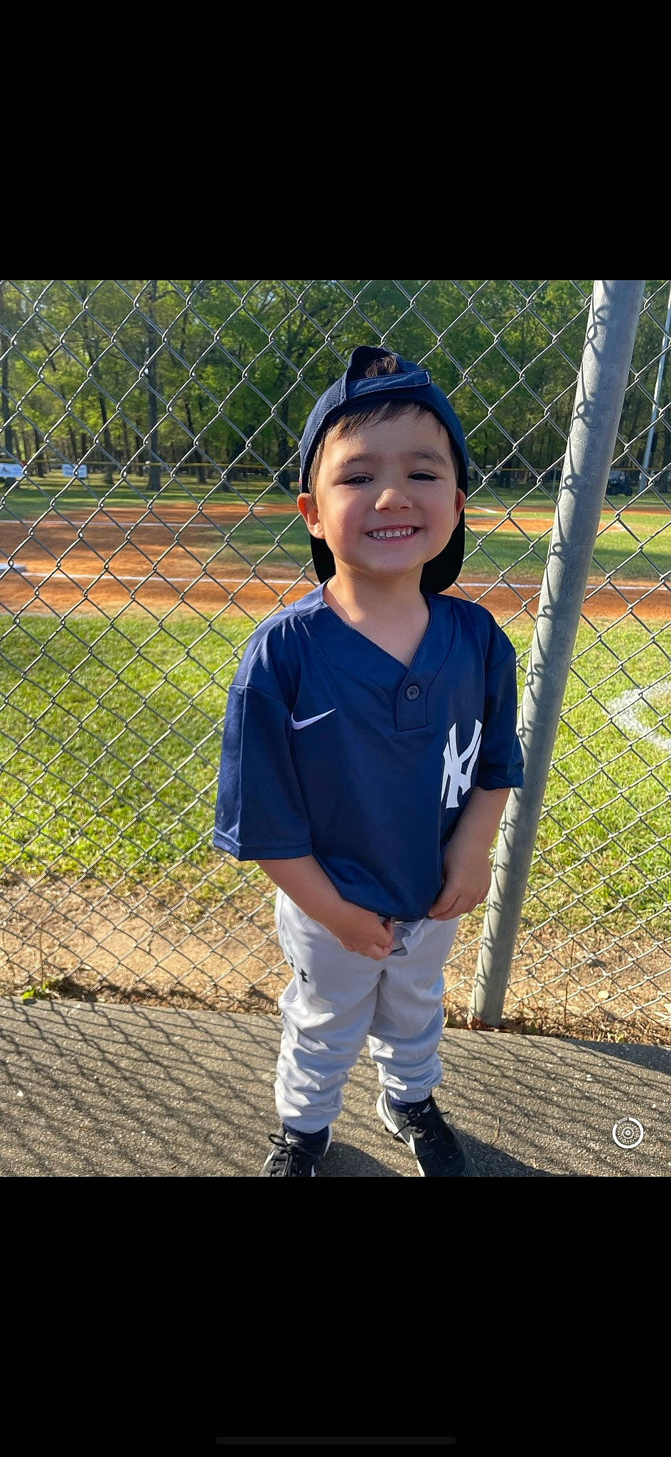 Maximus is registered to the contest to win money with this photo: ball_game, baseball, baseball_equipment, baseball_field, baseball_park, baseball_player, baseball_uniform, bat_and_ball_games, chain_link_fencing, college_baseball, fence, grass, joy, line, mesh, person, player, smile, sports_equipment, sports_uniform