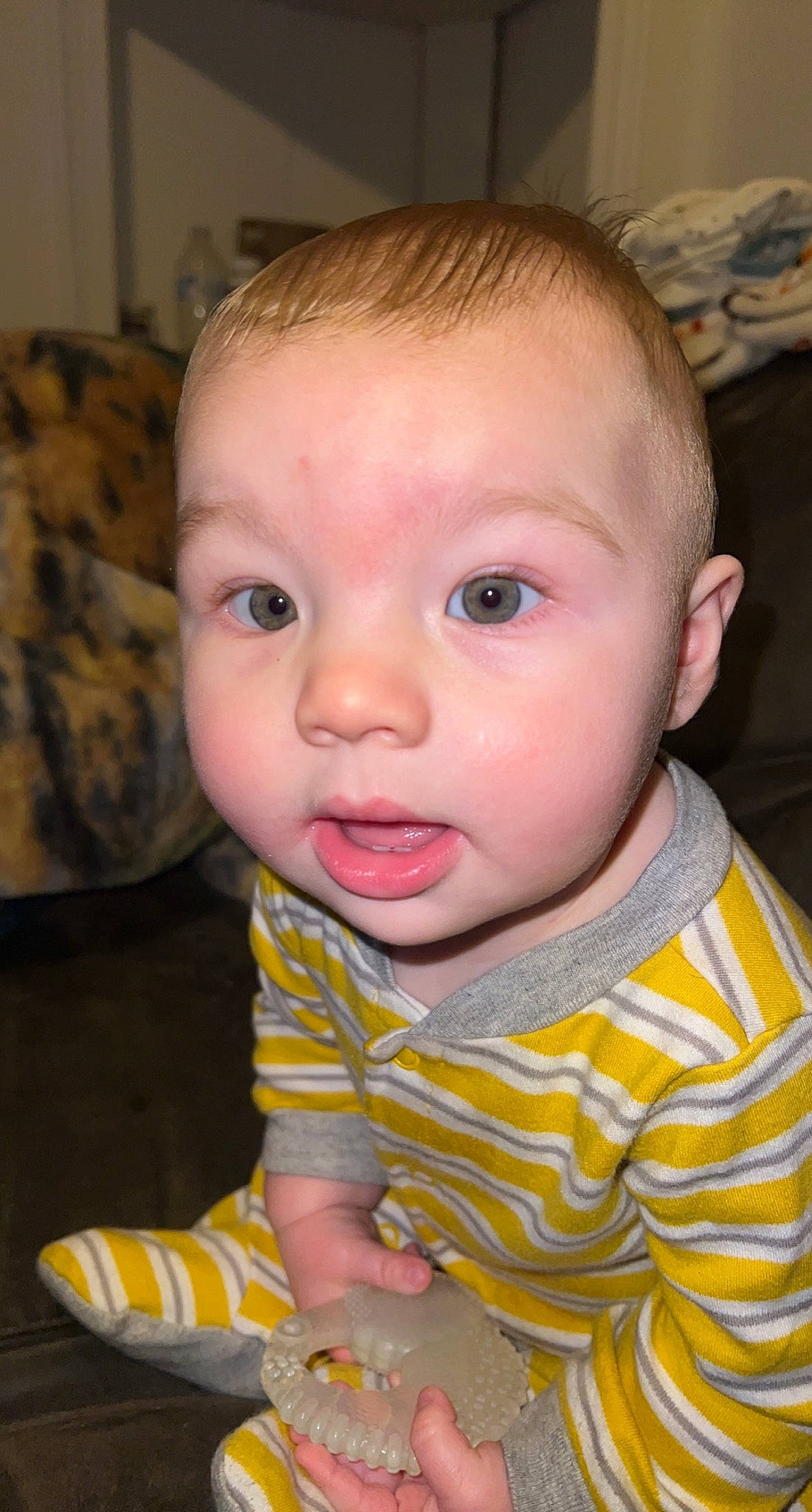 Declan is registered to the contest to win money with this photo: baby, baby_toddler_clothing, cheek, child, chin, ear, eye, eyebrow, eyelash, facial_expression, finger, forehead, iris, lip, mouth, nose, people, person, skin, sleeve