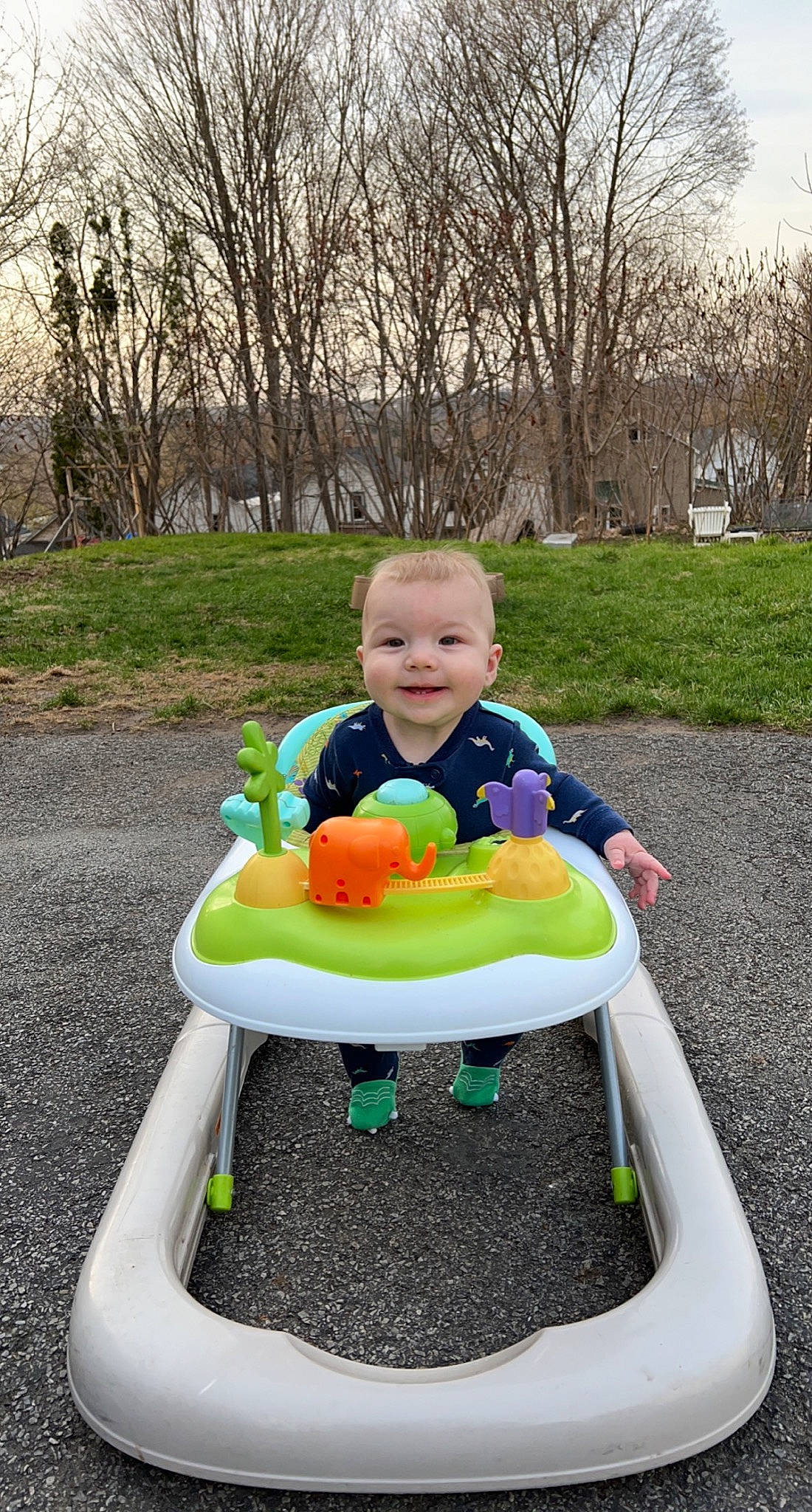 Declan is registered to the contest to win money with this photo: baby, baby_products, baby_toddler_clothing, eye, fun, grass, happy, head, human_body, joy, leisure, person, photograph, plant, play, playground, recreation, sitting, smile, toddler