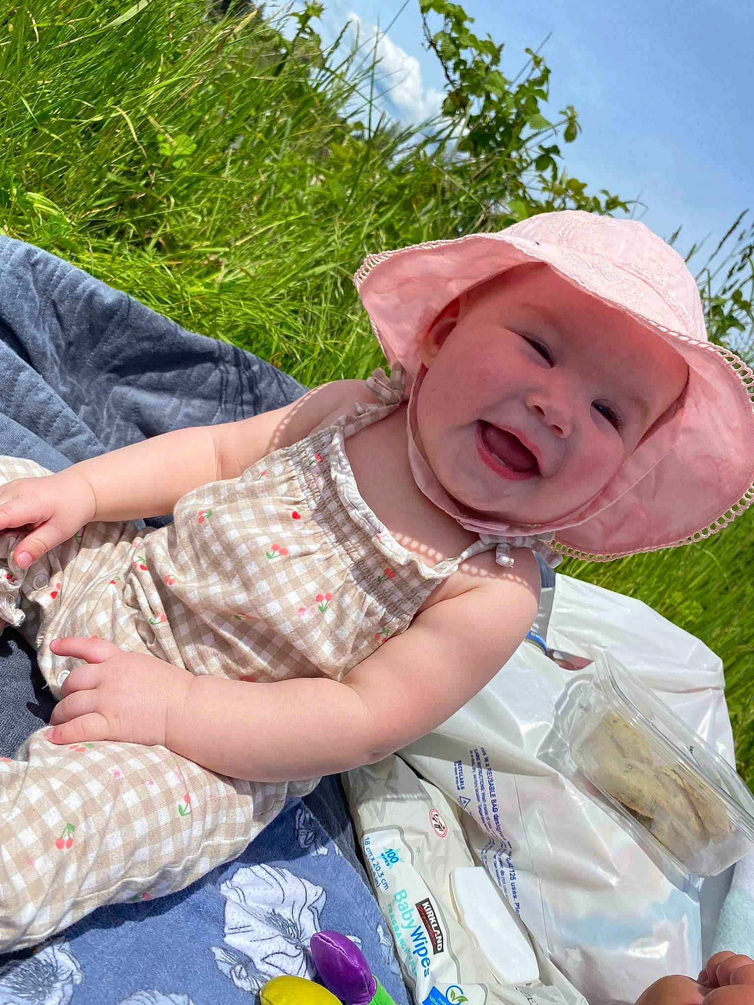 Nora joined the competition — help win amazing prizes! baby, baby_toddler_clothing, child, face, fashion_accessory, fun, grass, happy, hat, headwear, leisure, people_in_nature, person, plant, recreation, sky, smile, spring, summer, sun_hat