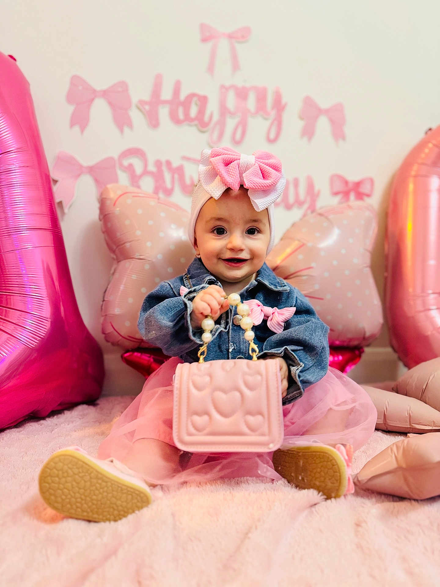 Karina is registered to the contest to win money with this photo: baby, child, girl, headband, bow, purse, pink, balloon, birthday, party_decor, denim_jacket, tutu, sitting, smile, face, shoes, indoor, plush_rug, heart_pattern, accessory