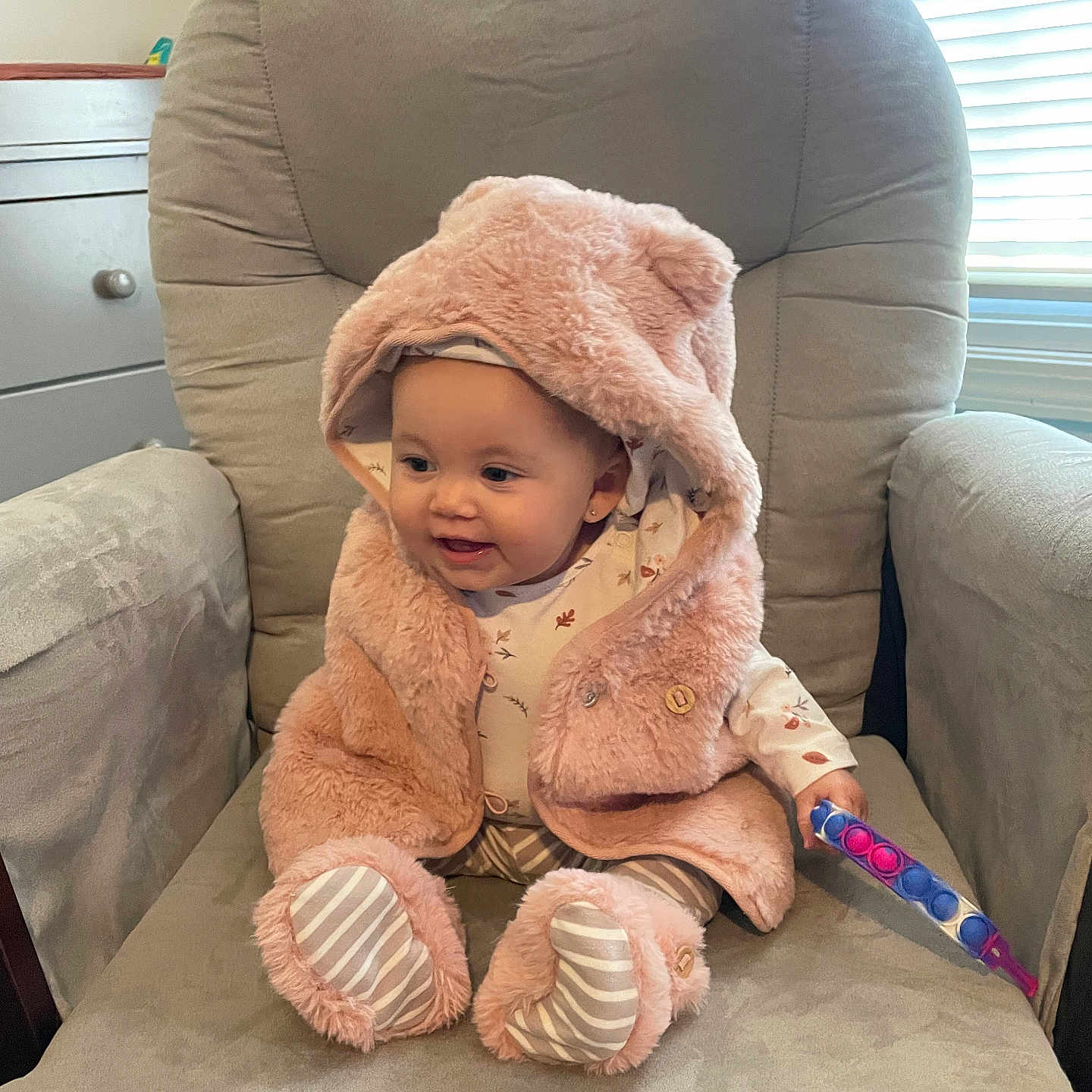 Violet joined the competition — help win amazing prizes! baby, babylaughing, blanket, bonnet, chair, clothing, cushion, face, furniture, happy, hat, head, homedecor, hood, person, photography, portrait, sitting, smile, towel