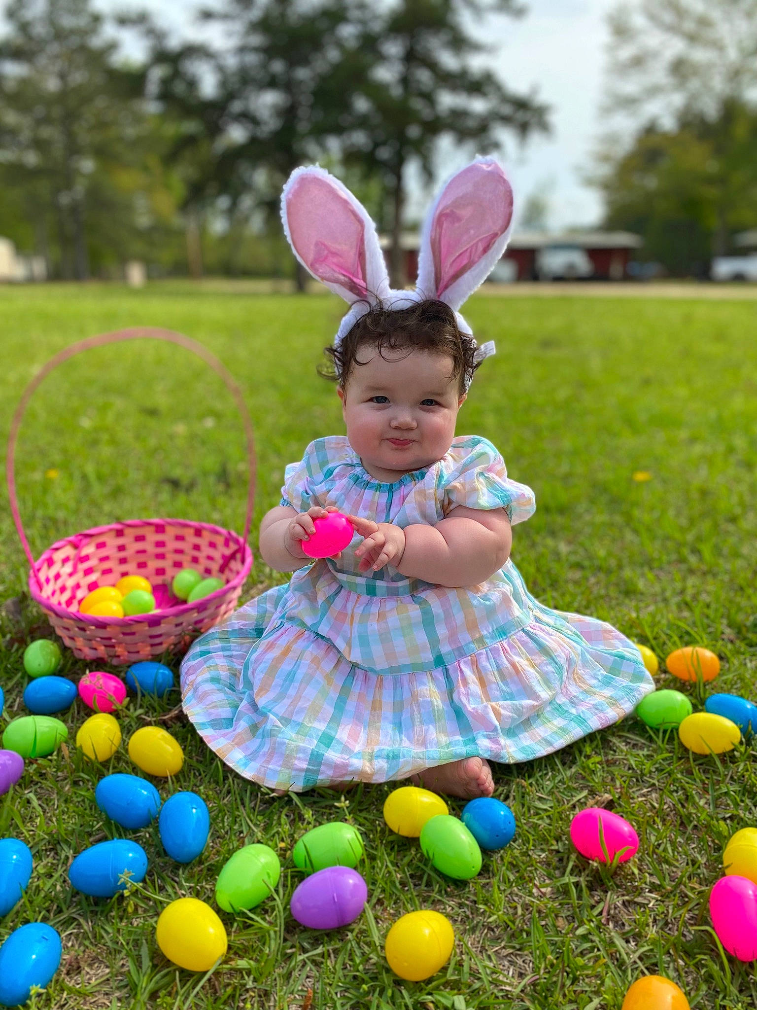Ivey is registered to the contest to win money with this photo: balloon, child, easter, easter_egg, event, fun, grass, happy, holiday, joy, lawn, leisure, nature, party_supply, person, pink, plant, rabbit, recreation, summer