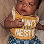 Knox joined the competition — help win amazing prizes! baby, infant, child, yellow_tank_top, blue_shorts, checkered, clothing, face, hair, expression, lying_down, beige_background, skin, hand, cute, young, portrait, casual, indoors, comfort