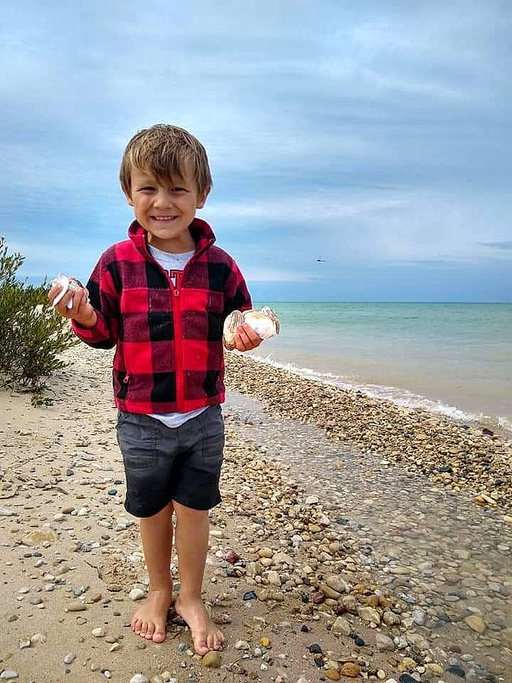 Kelvin is registered to the contest to win money with this photo: beach, child, coast, coastal_and_oceanic_landforms, design, fun, joy, leg, ocean, pattern, person, photography, plaid, play, sand, sea, shore, sky, standing, summer