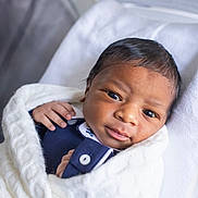 Kairo is registered to the contest to win money with this photo: newborn, baby, infant, wrapped, blanket, close_up, face, eyes, hand, soft, white, cloth, cute, lying_down, portrait, child, newborn_clothing, skin, head, sleeping_area