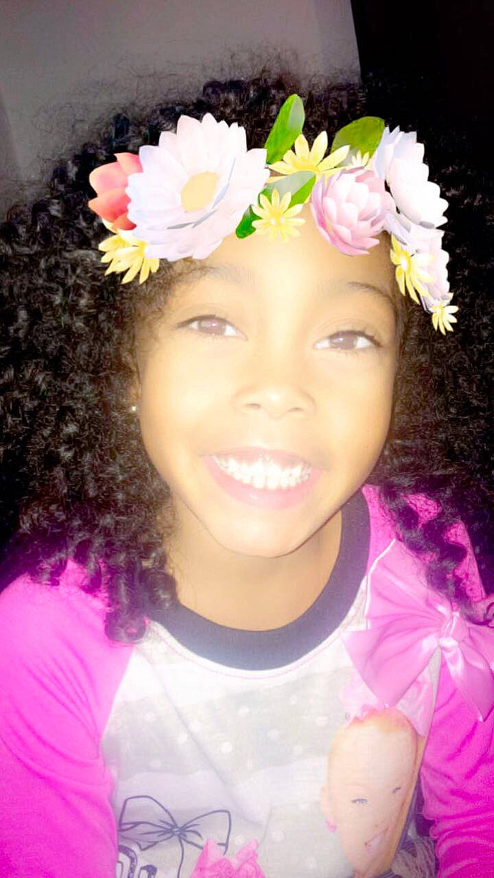 Semaj is registered to the contest to win money with this photo: child, face, fashion_accessory, floral_design, floristry, flower, flower_arranging, fun, girl, hair_accessory, hair_coloring, head, headband, headgear, headpiece, joy, lei, party_hat, person, petal