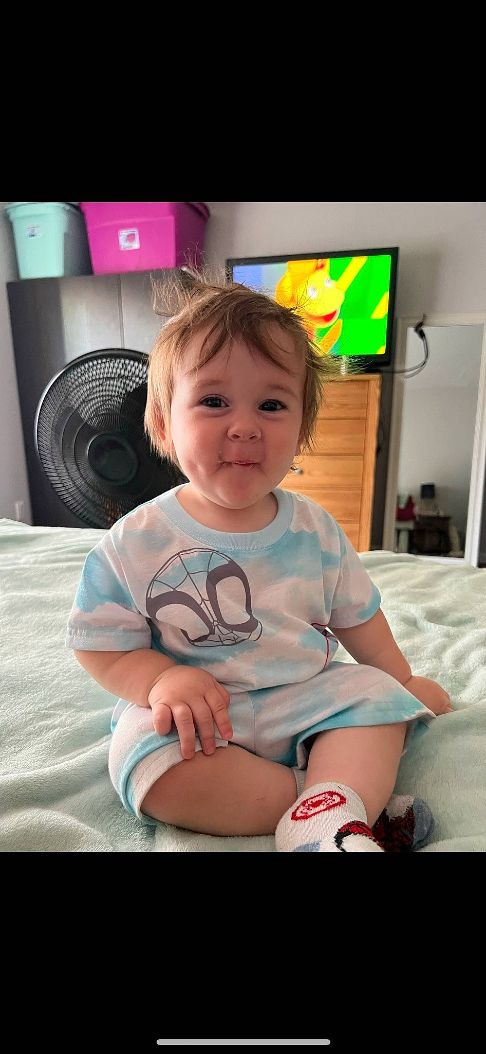 Ryker is registered to the contest to win money with this photo: baby, baby_toddler_clothing, cheek, child, comfort, facial_expression, flash_photography, flooring, fun, hairstyle, happy, human_leg, knee, output_device, person, sitting, skin, smile, t_shirt, thigh