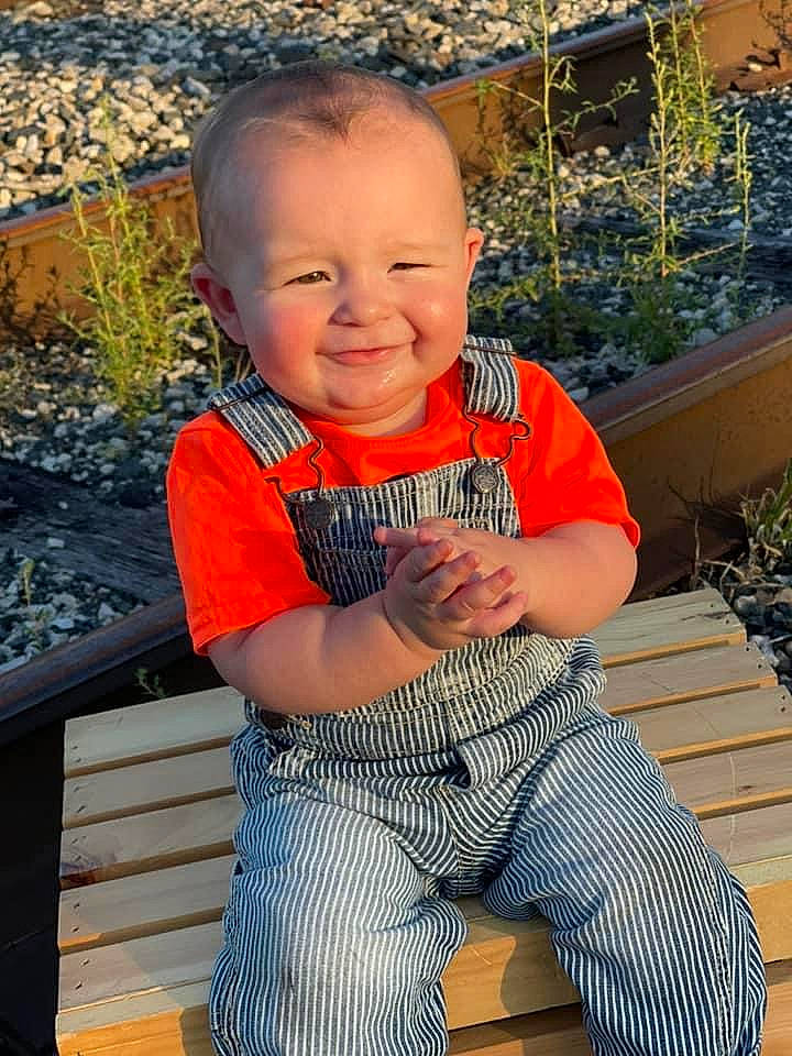 Nolan joined the competition — help win amazing prizes! baby_toddler_clothing, child, clothing, eye, face, grass, hairstyle, happy, head, human_body, joy, leisure, orange, people_in_nature, person, plant, skin, sleeve, smile, standing