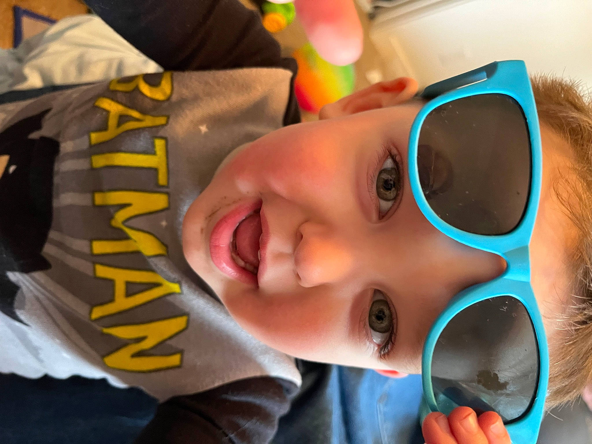 Luke is registered to the contest to win money with this photo: chin, ear, eye, eyebrow, eyelash, eyewear, glasses, goggles, hairstyle, happy, headwear, human_body, lip, mouth, neck, nose, orange, person, skin, smile