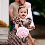 Ellie joined the competition — help win amazing prizes! toddler, child, bouquet, roses, dress, checkered, barefoot, outdoor, family, couple, blurred_background, smiling, cute, person, flower, summer, portrait, happy, young_child, nature