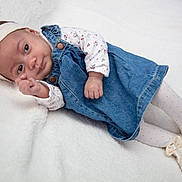 Mélaëlle Et Amaryah participe au concours pour gagner de l'argent avec cette photo : baby, infant, newborn, headband, denim_dress, floral_top, polka_dot_tights, baby_shoes, blanket, lying_down, face, eyes, hand, cute, cozy, soft_texture, portrait, white_background, buttons, footwear