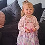 Nala-mai joined the competition — help win amazing prizes! toddler, child, girl, smile, standing, dress, floral, pink, bib, unicorn, pony_tail, couch, pillow, carpet, indoors, happy, clothing, person, cute, young