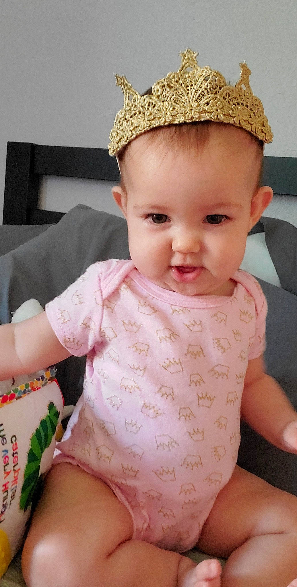 Kinslee is registered to the contest to win money with this photo: baby, baby_toddler_clothing, cap, cheek, chin, face, facial_expression, hairstyle, happy, head, human, lip, neck, organ, person, pink, skin, sleeve, smile, thigh