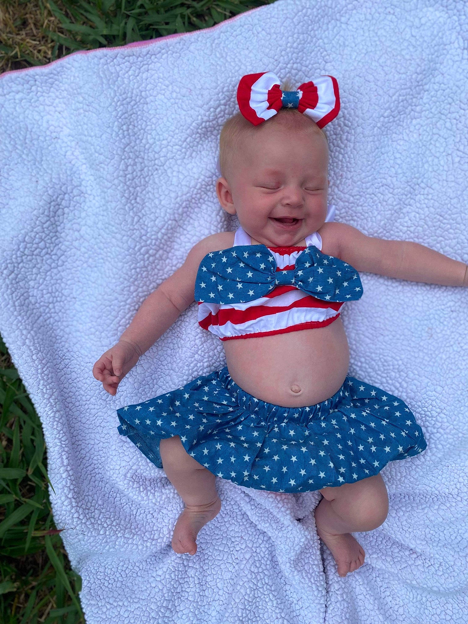 Adalynne joined the competition — help win amazing prizes! baby, baby_products, baby_toddler_clothing, clothing, design, electric_blue, glasses, goggles, human_leg, knee, pattern, person, sitting, sleeve, smile, sunglasses, textile, thigh, toddler, waist