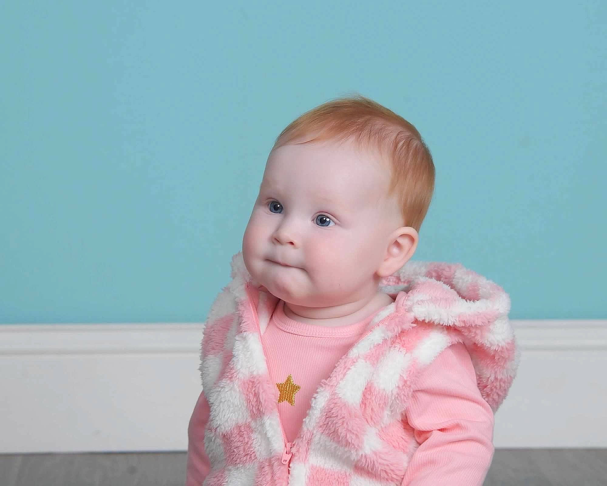 Luna is registered to the contest to win money with this photo: baby, baby_toddler_clothing, cheek, child, collar, eye, face, happy, iris, pattern, person, portrait_photography, sitting, skin, sleeve, toddler