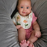 Bella is registered to the contest to win money with this photo: baby, bed, blanket, bodypart, couch, crib, cushion, face, finger, furniture, hand, head, homedecor, infantbed, newborn, person, photography, pillow, portrait, sitting