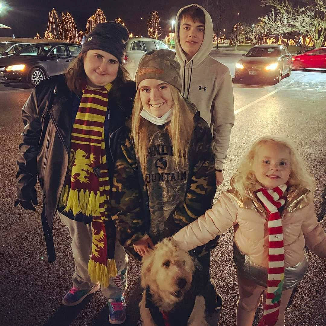 Ginny Lorraine Mcdonald joined the competition — help win amazing prizes! automotive_lighting, cap, carnivore, companion_dog, dog, dog_breed, eye, face, fur, happy, hat, human, jacket, mammal, small_terrier, smile, sporting_group, street_fashion, terrier, winter