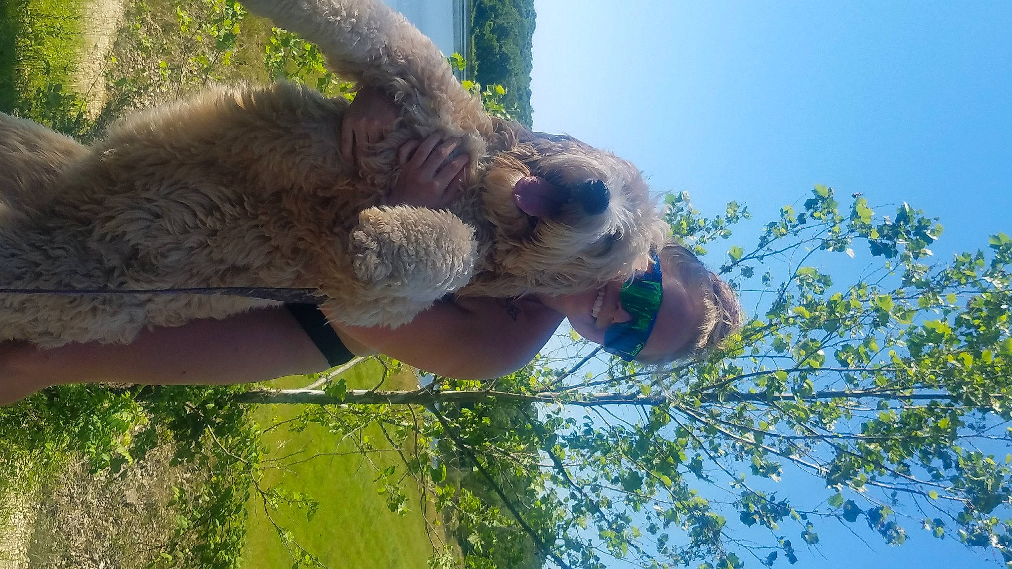 Ginny Lorraine Mcdonald is registered to the contest to win money with this photo: branch, fun, fur, glasses, grass, grass_family, happy, leisure, people_in_nature, plant, sky, sunglasses, tail, terrestrial_animal, tree, trunk, vertebrate, wildlife, wood, woody_plant