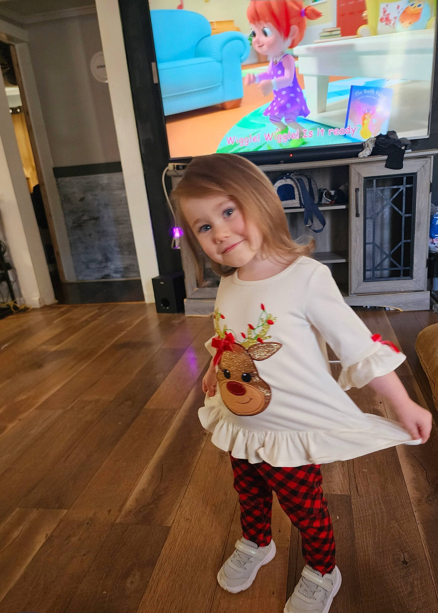 Riley joined the competition — help win amazing prizes! art, baby, baby_toddler_clothing, child, costume, event, flooring, fun, happy, hardwood, human_leg, joy, pattern, person, pink, smile, sock, standing, television, toddler