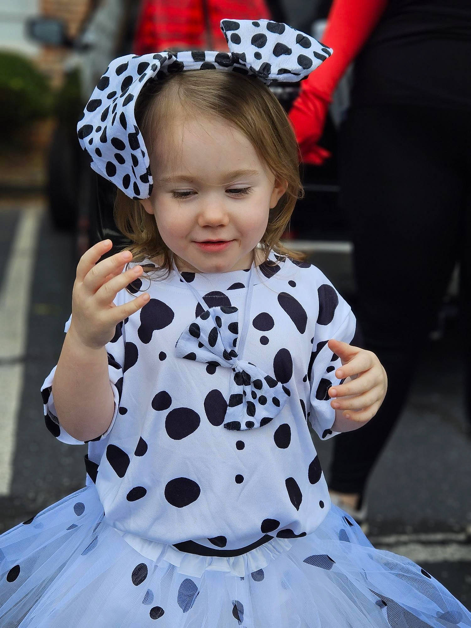 Riley joined the competition — help win amazing prizes! baby_toddler_clothing, black, child, costume_hat, day_dress, dress, event, face, fun, gesture, hairstyle, happy, hat, pattern, person, photograph, pink, sleeve, smile, toddler