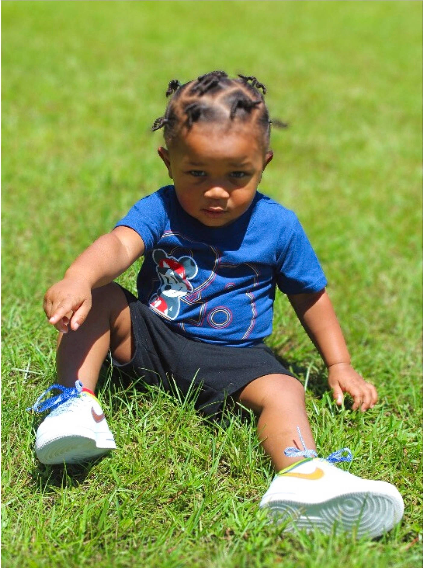 Levi is registered to the contest to win money with this photo: electric_blue, footwear, fun, grass, grass_family, grassland, hair, happy, head, knee, leisure, meadow, people_in_nature, person, player, shoe, shorts, sneakers, t_shirt, thigh