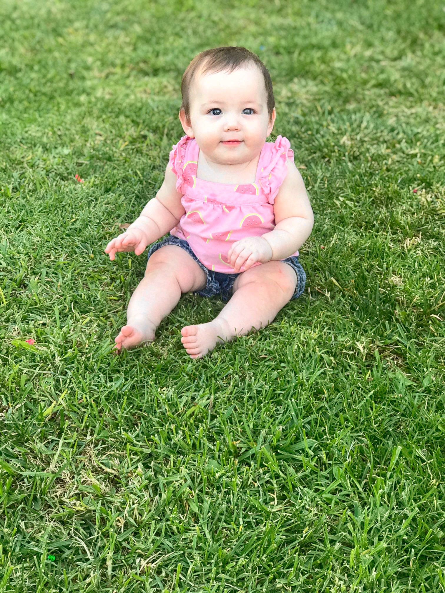 Avery Grace joined the competition — help win amazing prizes! baby, baby_toddler_clothing, ball, child, eye, facial_expression, foot, fun, grass, grass_family, grassland, groundcover, happy, joy, lawn, meadow, people_in_nature, person, plant, sitting