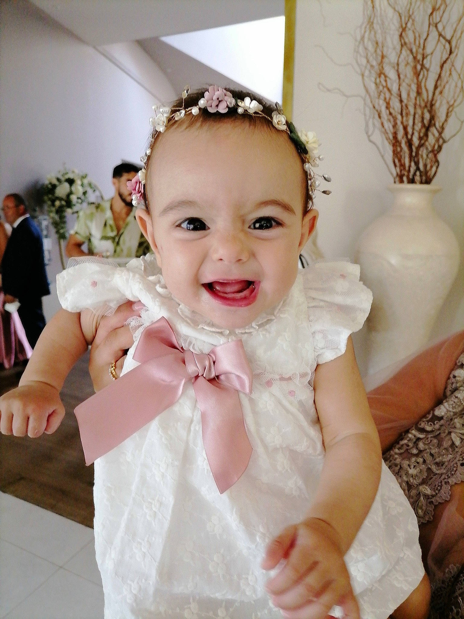 Gabriella a rejoint le concours — aidez-le/la à gagner de superbes lots ! baby, baby_toddler_clothing, bridal_accessory, bridal_clothing, dress, embellishment, formal_wear, gesture, gown, hairstyle, happy, headpiece, iris, joy, person, pink, shoulder, skin, sleeve, smile