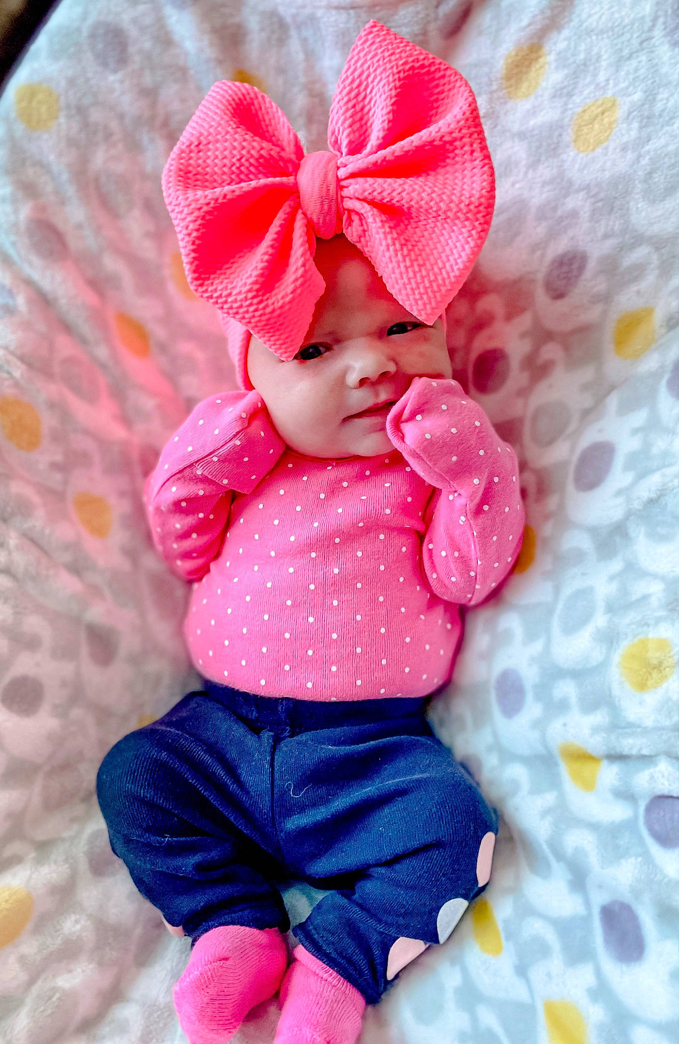 Khloe joined the competition — help win amazing prizes! baby, baby_products, baby_toddler_clothing, cap, child, electric_blue, fashion_accessory, happy, headgear, headwear, magenta, outerwear, pattern, person, pink, product, purple, red, sleeve, toddler