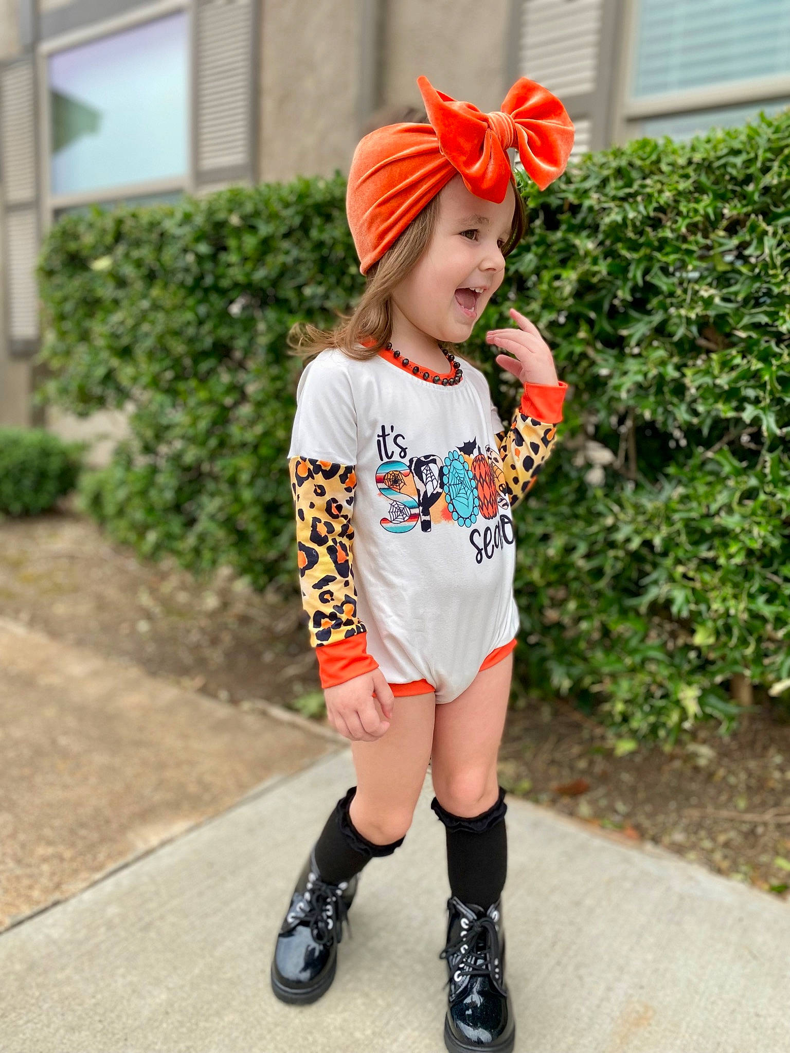 Kamree is registered to the contest to win money with this photo: cap, electric_blue, fashion_accessory, fashion_design, fun, fur, grass, headgear, headwear, human_leg, joy, knee, magenta, orange, pattern, peach, person, plant, sleeve, sportswear