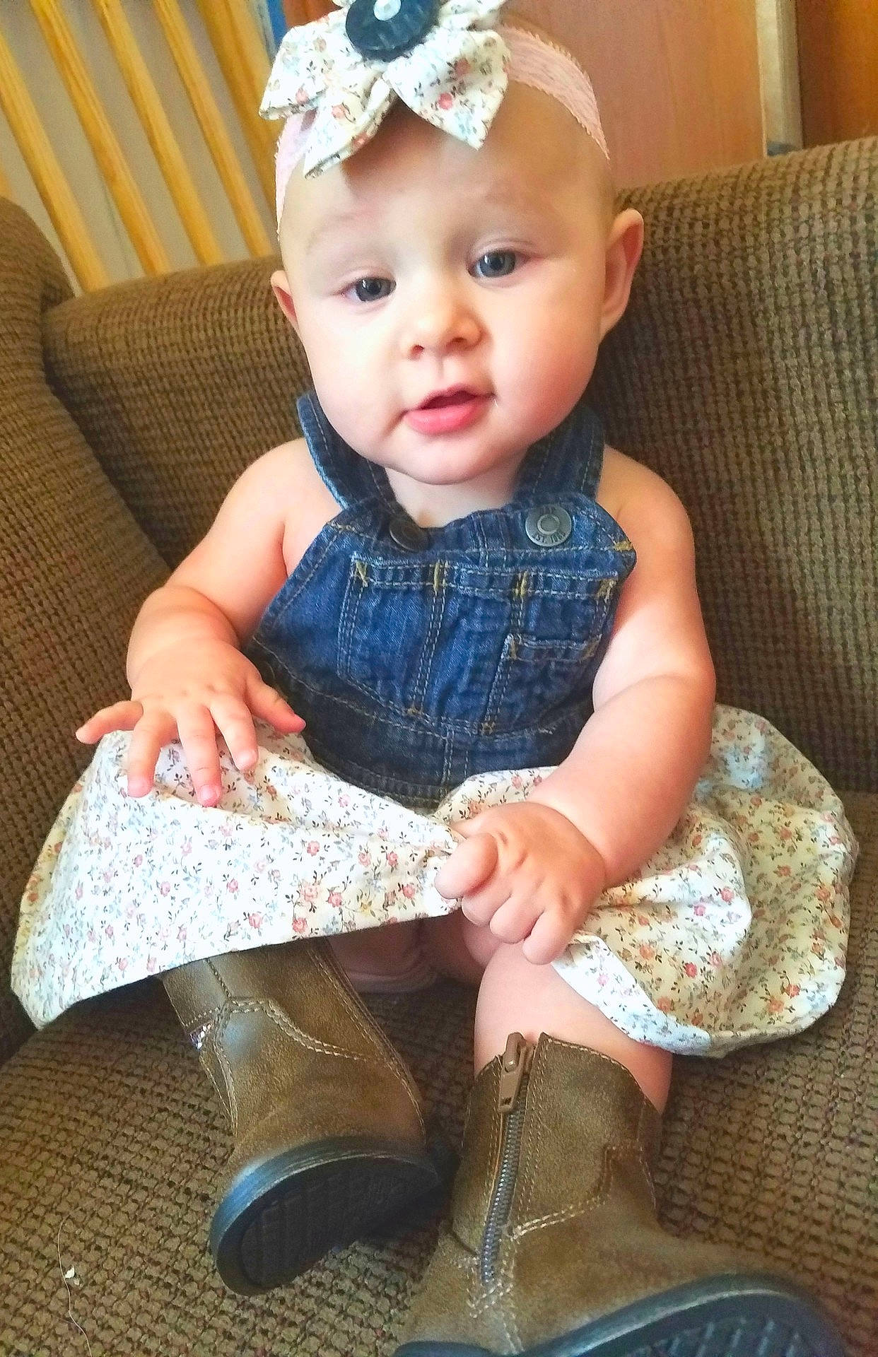 Judith is registered to the contest to win money with this photo: child, fashion_accessory, girl, hair_accessory, headband, headgear, headpiece, human_hair_color, infant, iris, pattern, person, product, sitting, skin, textile, toddler