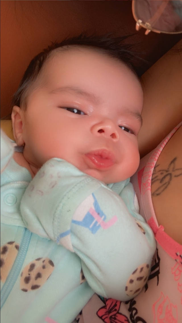 Culture is registered to the contest to win money with this photo: baby, baby_sleeping, baby_toddler_clothing, cheek, child, comfort, drinkware, eyelash, facial_expression, finger, happy, lip, mouth, nail, nose, person, pink, skin, stomach, thumb